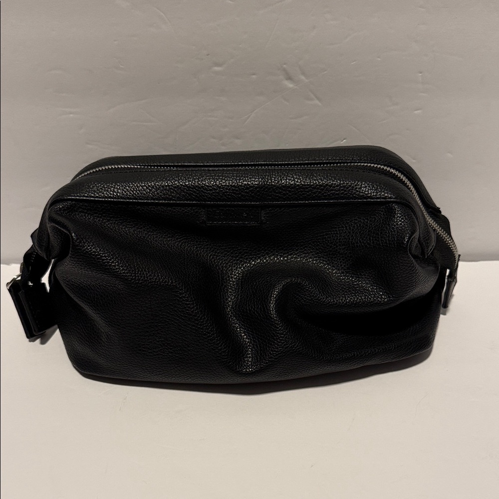 58.  Calvin Klein Black Textured Men's Toiletry Bag.